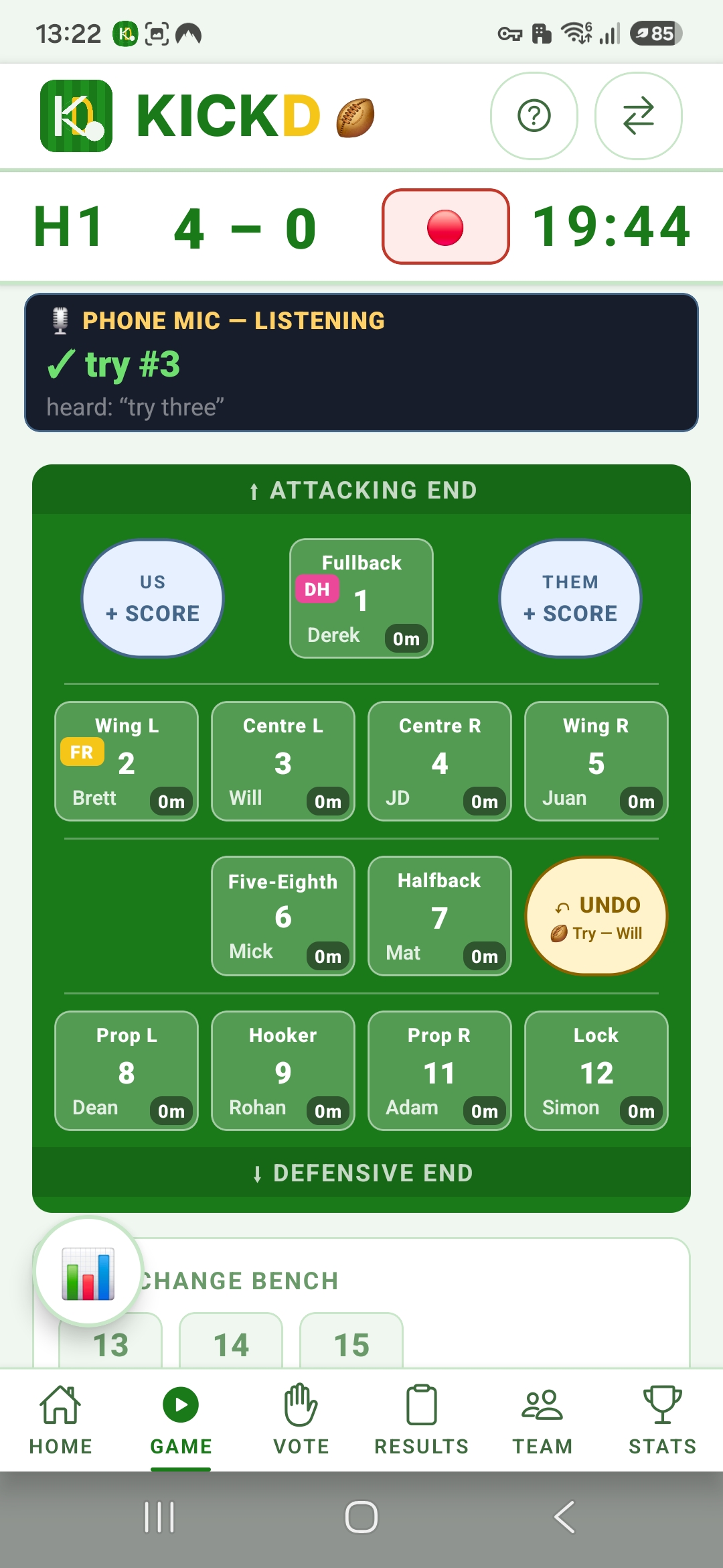 Kickd live junior rugby league field on a phone — the First Receiver (yellow) and Dummy Half (pink) vests on their players, with a try logged by voice